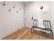 Chic entryway featuring modern bench, light fixture, and beautiful hardwood floors at 245 Roycroft Ln, Fayetteville, GA 30214