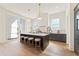 Spacious kitchen with a large island, modern appliances, and ample counter space for cooking at 245 Roycroft Ln, Fayetteville, GA 30214