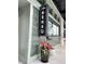 Exterior view of Sensu Sushi Restaurant and Bar, featuring a stylish sign and decorative flower pots at 245 Roycroft Ln, Fayetteville, GA 30214