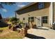Backyard patio featuring a brick facade, a peaceful sitting area, and mature landscaping at 3554 Umatilla Sw Ln, South Fulton, GA 30331