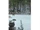 Backyard in winter featuring a snow covered yard and deer in the background at 3554 Umatilla Sw Ln, South Fulton, GA 30331