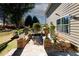 Walkway to backyard, featuring stone and brickwork, and mature landscaping at 3554 Umatilla Sw Ln, South Fulton, GA 30331