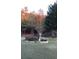 Serene backyard with vibrant flower beds, mature trees, and a well-maintained lawn at 3554 Umatilla Sw Ln, South Fulton, GA 30331