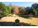 Expansive backyard featuring mature trees and an open lawn area at 3554 Umatilla Sw Ln, South Fulton, GA 30331