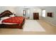 Spacious bedroom with a decorative bed frame, carpeted flooring, and ample natural light at 3554 Umatilla Sw Ln, South Fulton, GA 30331