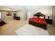 Large carpeted bedroom with a sitting area with a fireplace, entertainment center and a decorative bed frame at 3554 Umatilla Sw Ln, South Fulton, GA 30331