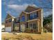 Charming two-story brick home with a well-manicured lawn and a two car garage on a sunny day at 3554 Umatilla Sw Ln, South Fulton, GA 30331