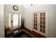 Bright foyer with hardwood floors, high ceilings, and decorative lighting fixtures near the white front door at 3554 Umatilla Sw Ln, South Fulton, GA 30331