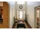 Bright foyer with hardwood floors, high ceilings, and decorative lighting fixtures near the white front door at 3554 Umatilla Sw Ln, South Fulton, GA 30331