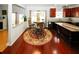 Eat-in kitchen with hardwood floors, cherry cabinets, a breakfast bar, and a breakfast table at 3554 Umatilla Sw Ln, South Fulton, GA 30331