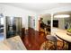 Bright kitchen and breakfast nook open to the Gathering room featuring stainless steel appliances and wood floors at 3554 Umatilla Sw Ln, South Fulton, GA 30331