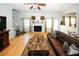 Cozy living room with wood floors, fireplace and large windows offering plenty of natural light at 3554 Umatilla Sw Ln, South Fulton, GA 30331