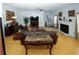 Expansive living room featuring a fireplace, wood floors, and access to a dining area at 3554 Umatilla Sw Ln, South Fulton, GA 30331