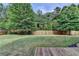 Large backyard with a wooden fence at 4191 Secret Shoals Way, Buford, GA 30518