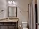 Bathroom features granite countertops and coordinated fixtures at 4191 Secret Shoals Way, Buford, GA 30518