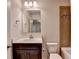 Bathroom with vanity, mirror, toilet, tub and tile accents, showcasing modern features and fixtures at 4191 Secret Shoals Way, Buford, GA 30518