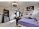 Bedroom featuring ceiling fan, carpet flooring, and window bringing natural light at 4191 Secret Shoals Way, Buford, GA 30518