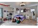 Bedroom featuring ceiling fan, carpet flooring, and window bringing natural light at 4191 Secret Shoals Way, Buford, GA 30518
