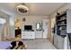 Bedroom featuring a ceiling fan, a dresser, a television, a bookshelf and a doorway to a bathroom at 4191 Secret Shoals Way, Buford, GA 30518