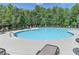 Community pool with lounge chairs and greenery at 4191 Secret Shoals Way, Buford, GA 30518