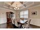 Elegant dining room features coffered ceiling, seating for six, and built-in hutch at 4191 Secret Shoals Way, Buford, GA 30518