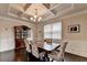 Traditional dining area boasts hardwood flooring, decorative trim, and coffered ceiling at 4191 Secret Shoals Way, Buford, GA 30518