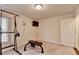 Bright exercise room with equipment, carpeted floors, neutral walls, and plenty of space for a personal gym setup at 4191 Secret Shoals Way, Buford, GA 30518