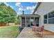 Exterior shot of the house showing the sunroom and wooden patio at 4191 Secret Shoals Way, Buford, GA 30518