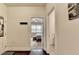 Bright hallway with hardwood floors that leads to a well-lit bedroom at 4191 Secret Shoals Way, Buford, GA 30518