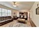 Open-concept living room showcases hardwood floors and seamless flow into the kitchen at 4191 Secret Shoals Way, Buford, GA 30518