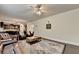 Spacious living room showcasing hardwood floors, neutral walls, and a view into the kitchen at 4191 Secret Shoals Way, Buford, GA 30518