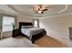 Spacious main bedroom with neutral tones, tray ceiling, and comfortable carpet at 4191 Secret Shoals Way, Buford, GA 30518