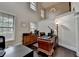 Bright office features large windows, high ceiling, hardwood floors, chandelier, and workspace at 4191 Secret Shoals Way, Buford, GA 30518