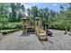 Community playground with a slide, climbing structure, and swing set, perfect for Gathering fun at 4191 Secret Shoals Way, Buford, GA 30518
