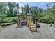 Community playground with climbing structures, slide and swings at 4191 Secret Shoals Way, Buford, GA 30518