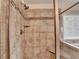 Bathroom shower with modern tile, rainfall shower head and a built-in bench at 4191 Secret Shoals Way, Buford, GA 30518