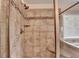 Close up of the shower with glass door, tiled walls, and bench at 4191 Secret Shoals Way, Buford, GA 30518