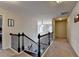 Hallway with a staircase, carpet, and decorative lighting at 4191 Secret Shoals Way, Buford, GA 30518