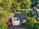 Aerial view of the back of the house including back deck and backyard, surrounded by mature trees at 511 Oakview Rd, Decatur, GA 30030