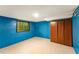 Spacious basement with blue walls, storage cabinets and lots of potential at 511 Oakview Rd, Decatur, GA 30030