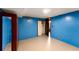 Another view of the finished basement with blue walls and closet at 511 Oakview Rd, Decatur, GA 30030
