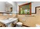 Bathroom with a vintage sink, toilet, and tile accents, offering a cozy space at 511 Oakview Rd, Decatur, GA 30030