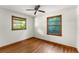 Bedroom featuring hardwood floors, natural light from two windows, and a cozy atmosphere at 511 Oakview Rd, Decatur, GA 30030