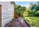 View of backyard with a side view of the house with wooden staircase to the second story at 511 Oakview Rd, Decatur, GA 30030