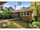 Charming brick home with a well-manicured lawn and lush landscaping in a peaceful residential neighborhood at 511 Oakview Rd, Decatur, GA 30030