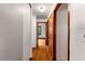 Hallway with hardwood floors, white walls, and wooden doors leading to other rooms in the house at 511 Oakview Rd, Decatur, GA 30030