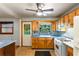Cozy kitchen with light wood cabinets, modern appliances, and natural light from the window at 511 Oakview Rd, Decatur, GA 30030