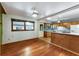 Kitchen featuring hardwood floors adjacent, wood cabinets, a breakfast bar, tile backsplash, and natural light at 511 Oakview Rd, Decatur, GA 30030