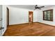 Living room with hardwood floors, ceiling fan, natural light, and an open view to the kitchen at 511 Oakview Rd, Decatur, GA 30030