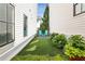 Small backyard with blue Adirondack chairs, artificial grass, and plenty of room to relax at 6815 Halcyon Way, Alpharetta, GA 30005